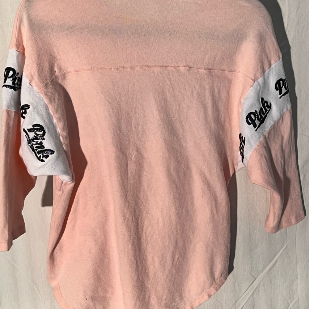 PINK baseball tee with sequined logo on front and on arms.  Size XS pale pink